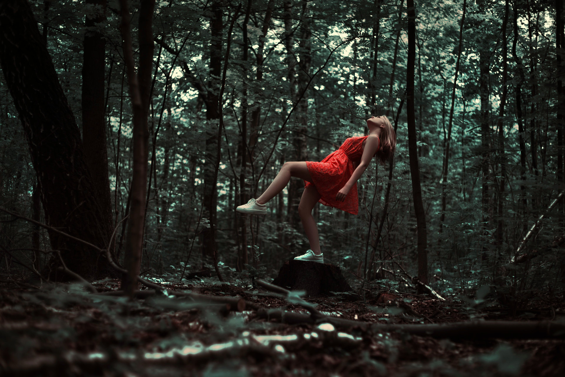 Image from Pixabay of woman in a red dress taking a step forward (and also leaning upward).